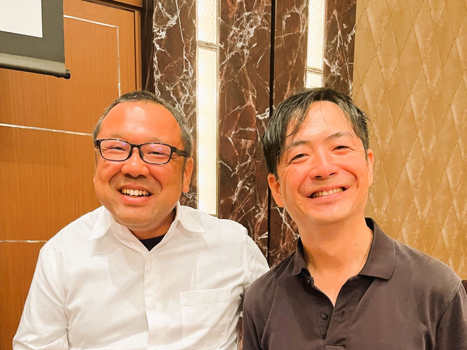 2026年のJBN全国大会で山本大介と空調設計講座の講師である森亨介さんが並ぶ写真
